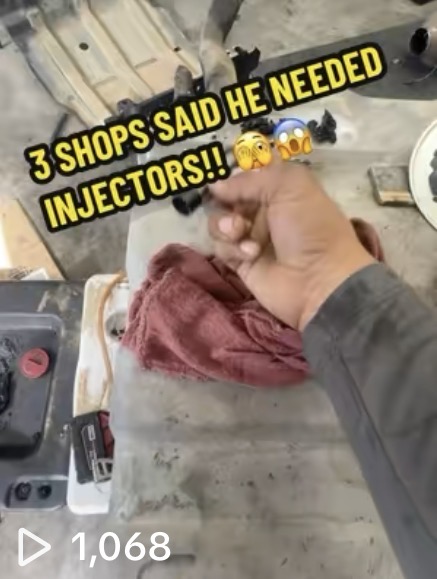 Heavy equipment repair and fleet maintenance - Injector diagnostic work showing technician hands inspecting parts